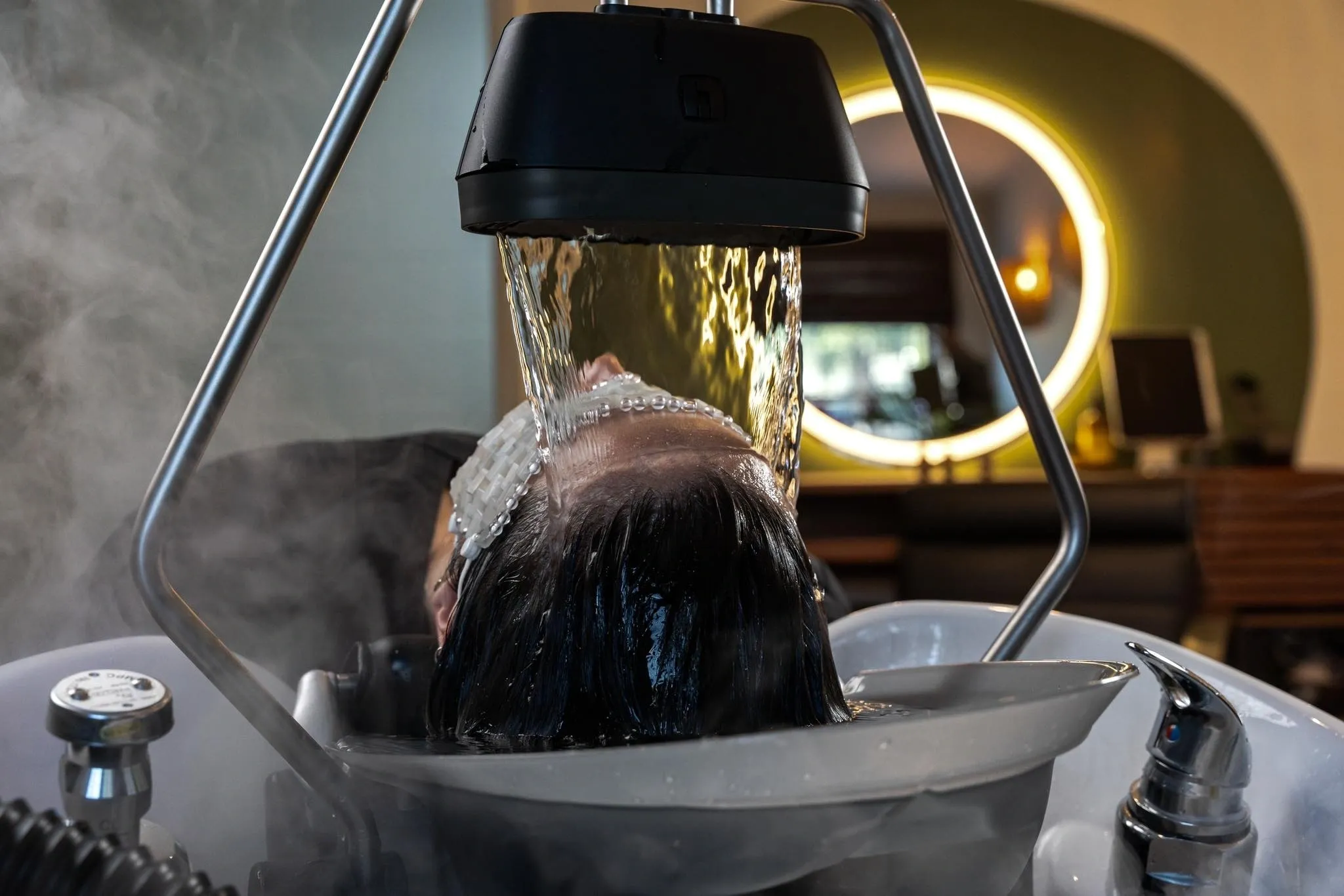 A Woman Getting A Hair Spa With Water